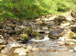 SX18191 Water flowing down Caerfanell river.jpg